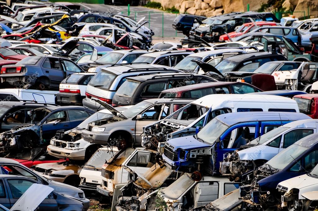 Rows of junk cars stacked in a Massachusetts salvage yard